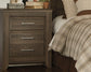 Juararo King Panel Bed with Mirrored Dresser and 2 Nightstands